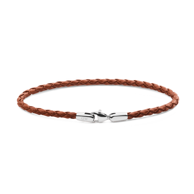 Slim braided tan leather bracelet with a polished silver clasp, showcasing a minimalist and versatile design suitable for men’s everyday wear.