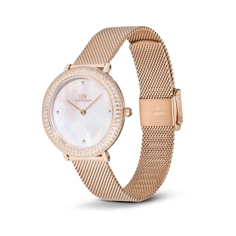 Crystalline Bezel Melrose rose gold ladies watch with a crystal-set bezel, white mother of pearl dial, and an adjustable rose gold mesh strap, offering a sophisticated and versatile accessory for everyday wear.
