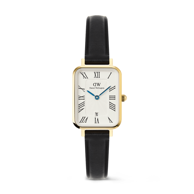 Quadro Roman Numerals Date Sheffield Gold ladies watch with a rectangular gold case, white guilloché dial featuring bold Roman numerals, blue hands, date window at 6 o’clock, and a slim black leather strap.