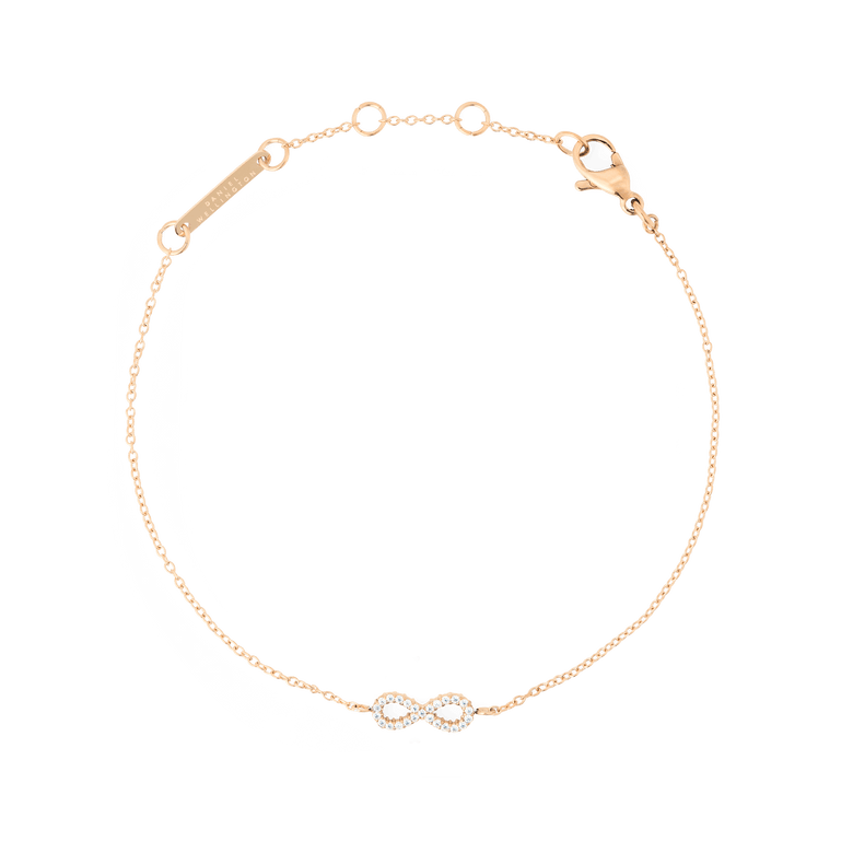 Delicate rose gold bracelet featuring a fine adjustable chain and an infinity charm set with sparkling white cubic zirconia stones, designed for a refined and timeless look.