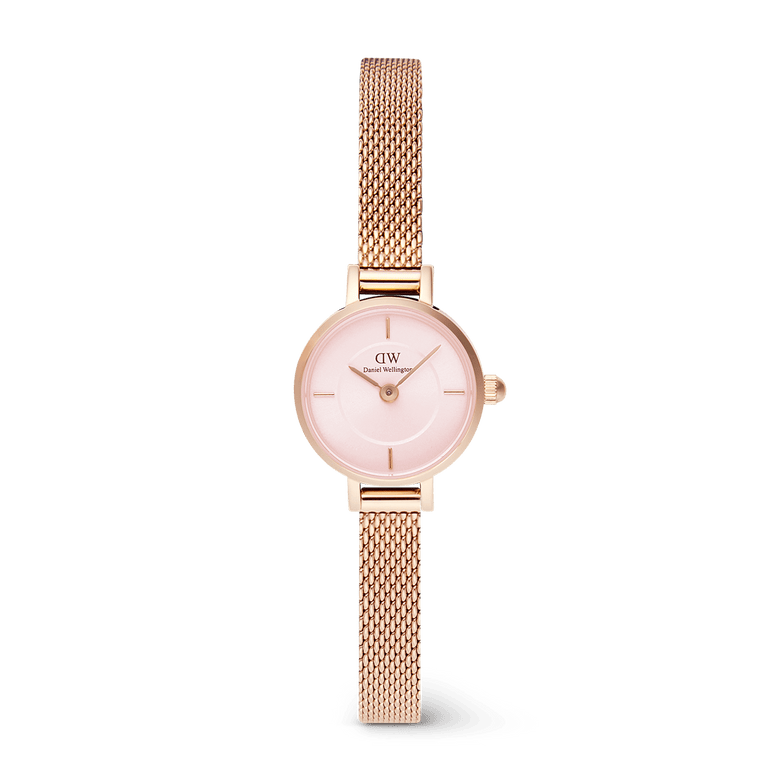 Petite Mini Blush Melrose features a 19mm rose gold case, blush pink sunray dial, and an adjustable mesh strap, offering a refined and lightweight watch suitable for everyday wear.