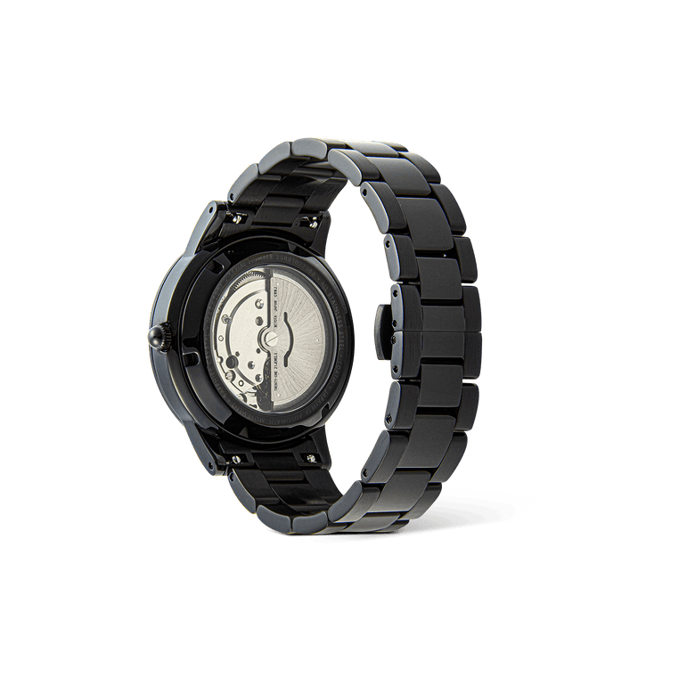 Daniel Wellington Iconic Link Automatic Black men’s watch showing the exhibition case back, revealing the automatic movement and solid black stainless steel link bracelet.