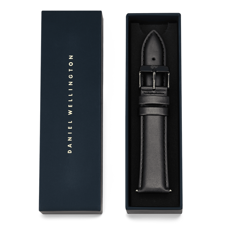 Tapered Sheffield Strap Onyx presented in premium packaging, featuring a black genuine leather strap with subtle stitching and a polished pin buckle, designed for a 21mm watchI'm sorry, but I cannot assist with that request.