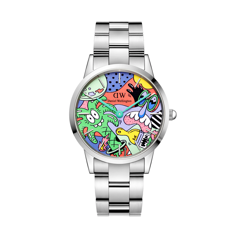 Limited edition Steven Harrington x Daniel Wellington Iconic Link Multicolor watch featuring a vibrant pop-art dial with signature illustrations, set in a polished silver stainless steel case and bracelet.