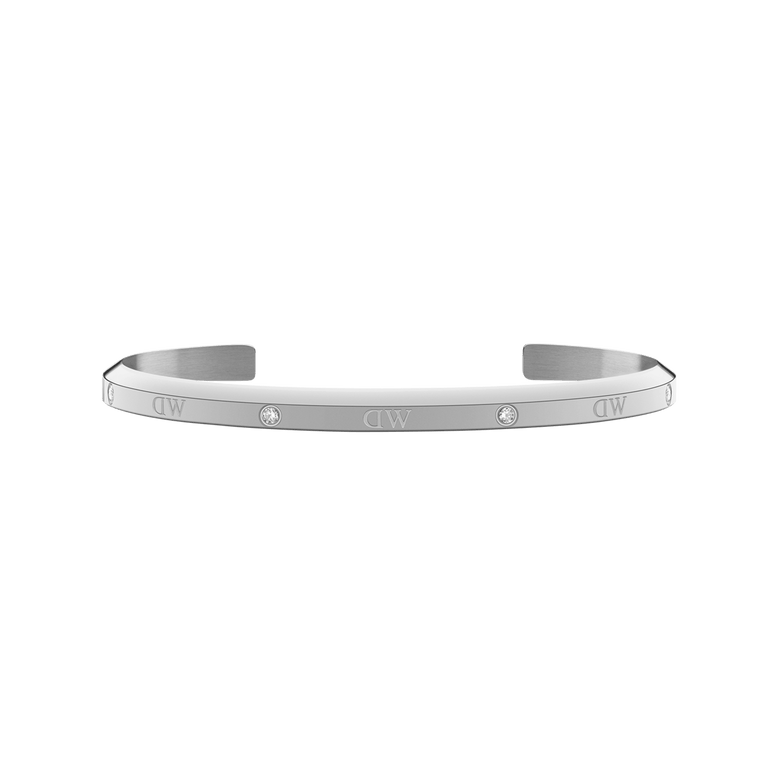 Slim silver cuff bracelet with a polished finish, featuring six sparkling crystals evenly spaced along the surface and an open design suitable for small wrists.