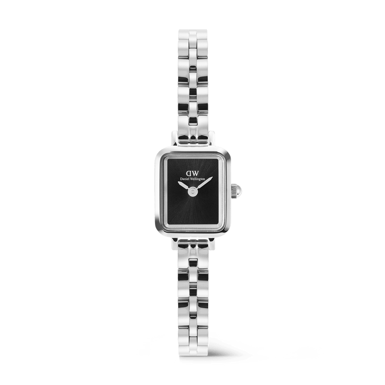 Quadro Mini Arch 3-link Onyx Sunray Silver features a petite rectangular silver case, a slim three-link stainless steel bracelet, and a minimalist black sunray dial without indices, offering a refined and versatile accessory for women.