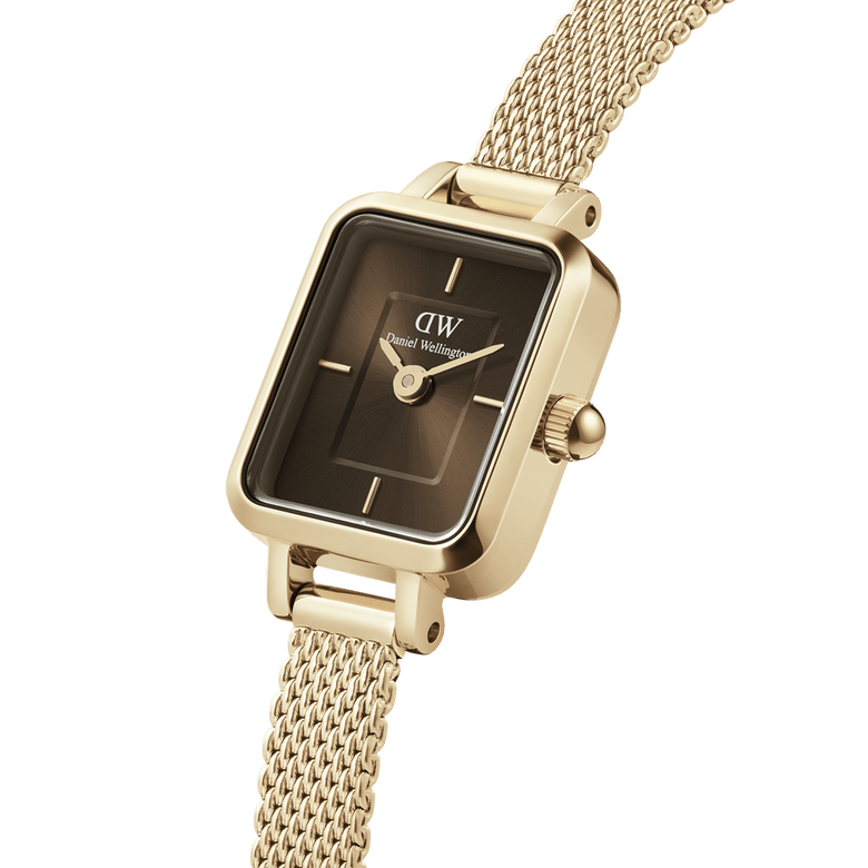 Quadro Mini Evergold Amber showcases a rectangular amber sunray dial with minimalist hour markers, complemented by a slim gold mesh strap and polished gold-plated case for a refined, modern look.