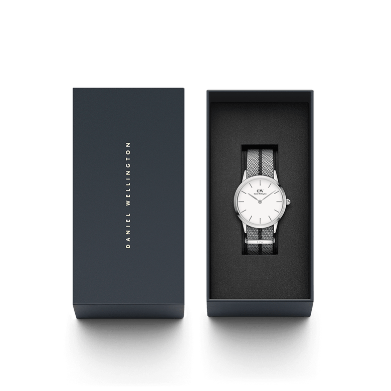 Daniel Wellington Iconic NATO Grey/Black watch presented in a sleek gift box, featuring a minimalist white dial and a grey and black NATO strap with a twill weave.