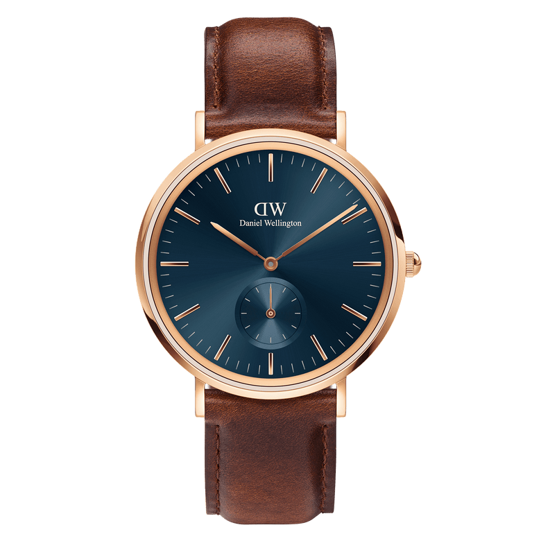 Classic Multi-Eye St Mawes Arctic Rose Gold men's watch featuring a round rose gold case, minimalist blue dial with chronograph subdial, and a brown leather strap.