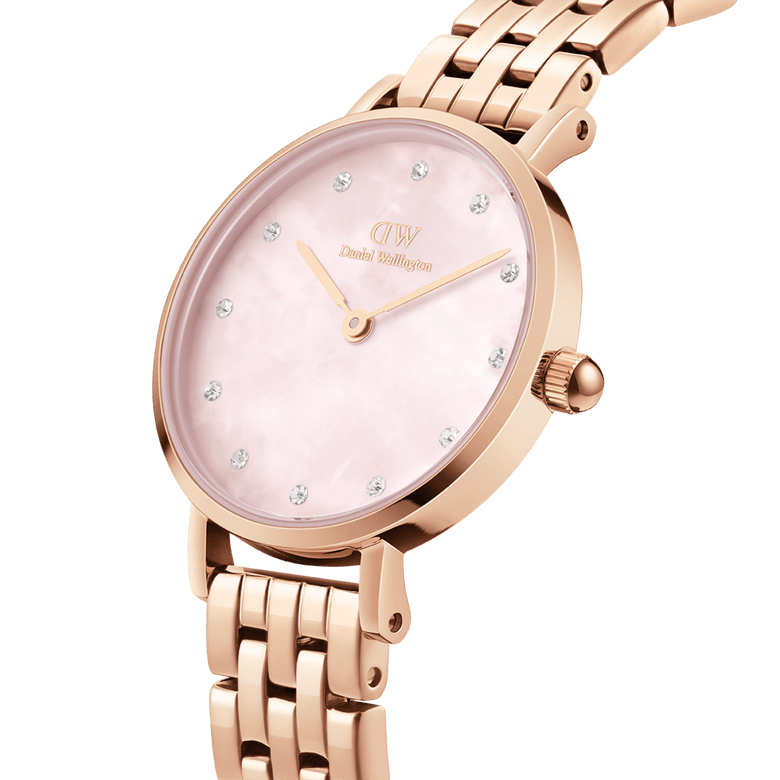 Close-up of the Petite Lumine 5 Link Melrose Pink MoP Rose Gold watch, showing its rose gold bracelet, pink mother of pearl dial, and crystal hour markers for a sophisticated finish.
