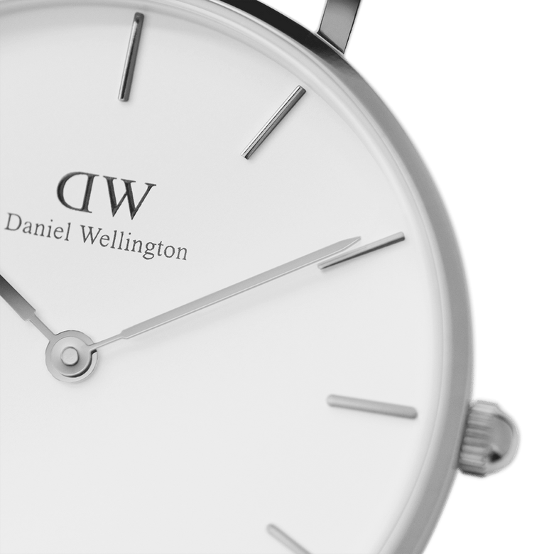 Close-up of the Petite Sheffield Silver watch face, showing the eggshell white dial, minimalist silver hands, and polished stainless steel case with subtle line hour markers.