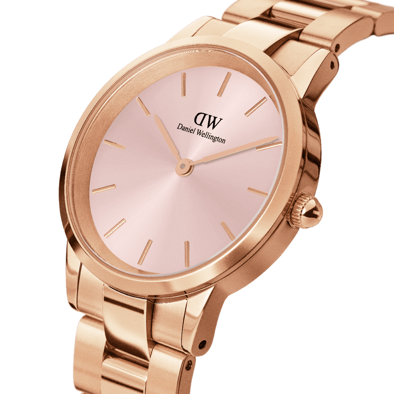Close-up of the Iconic Link Pink Rose Gold ladies watch, featuring a soft pink sunray dial, minimalist gold hour markers, and a polished rose gold stainless steel link bracelet.