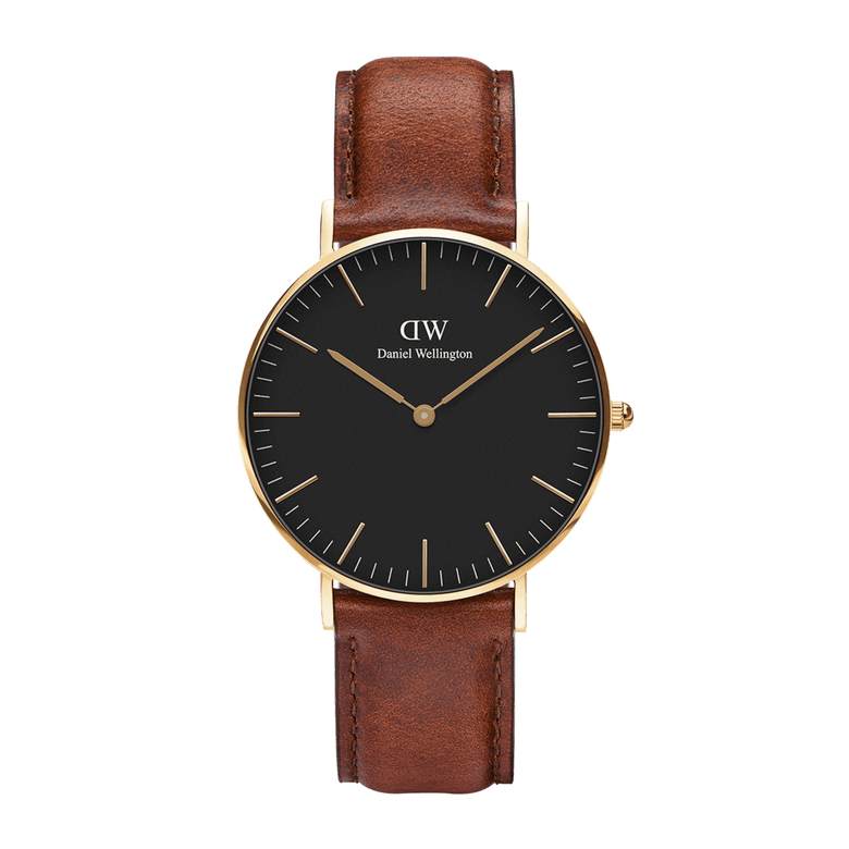 Classic St Mawes Gold watch with a slim gold-plated case, matte black dial, minimalist gold hour markers, and a brown leather strap suitable for both formal and casual wear.