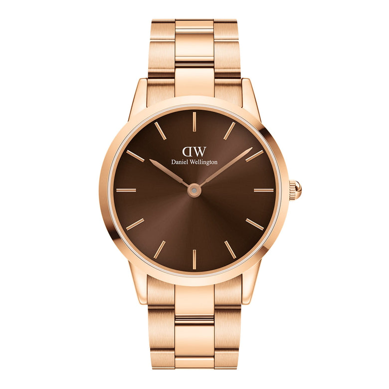 Daniel Wellington Iconic Link Amber watch with a rose gold stainless steel bracelet and a sunray brown dial, featuring minimalist hour markers and a modern, elegant design.