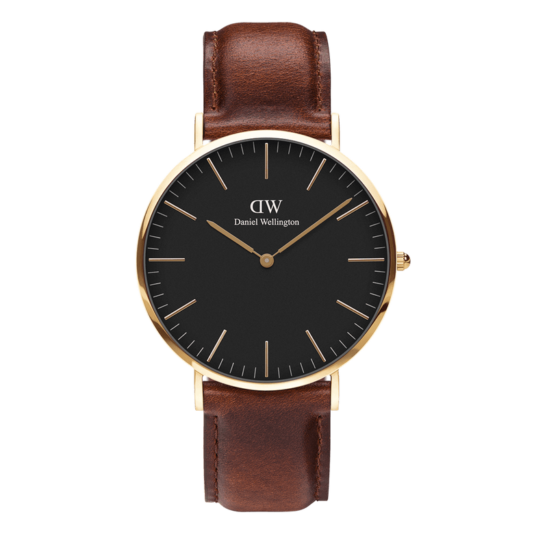 Classic St Mawes Gold watch featuring a matte black dial, gold-plated round case, minimalist hour markers, and a rich brown leather strap with a smooth finish.