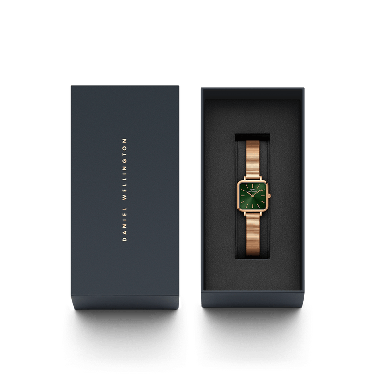 Quadro Studio Emerald Rose Gold ladies watch presented in a premium Daniel Wellington gift box, featuring a square emerald green dial and rose gold mesh bracelet.
