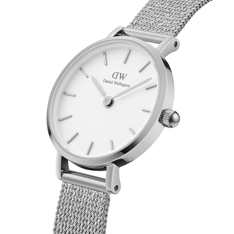 Petite Pressed Sterling silver ladies watch with a 24mm stainless steel case, minimalist eggshell white dial, and an adjustable mesh bracelet, shown in a close-up angle highlighting its refined details.