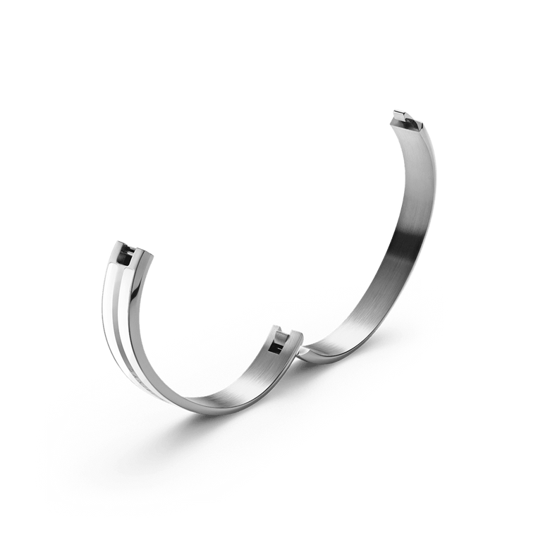 Emalie Infinite Silver Satin White bracelet shown open, highlighting the integrated closing system and brushed stainless steel interior for a secure and comfortable fit.