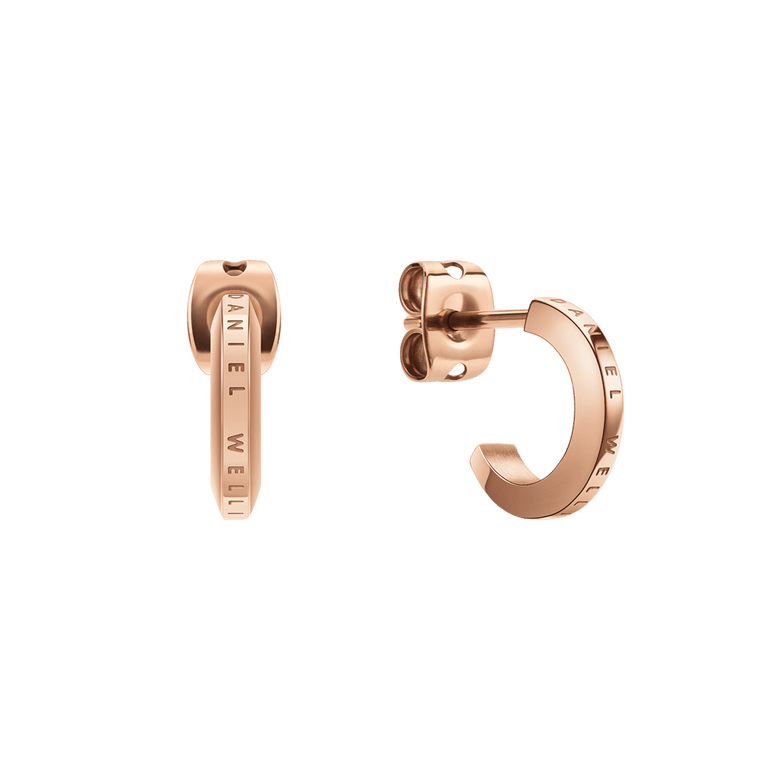 A pair of Daniel Wellington Elan Earrings in rose gold, featuring a petite huggie design with a subtle engraved logo and a smooth, polished finish, shown from both front and side angles.