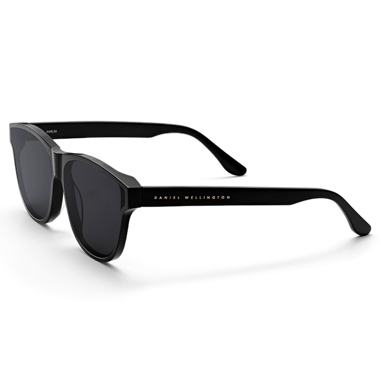 Ambler Bio-Acetate Black sunglasses with a sleek all-black Italian bio-acetate frame, dark UV400 lenses, and the Daniel Wellington logo subtly displayed on the arm.