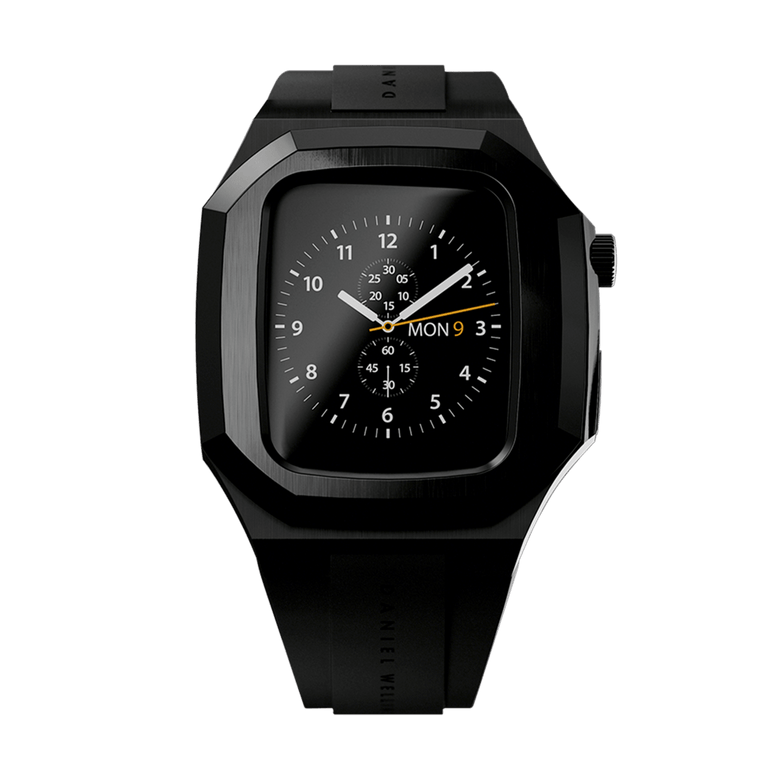 Switch Black Black Apple Watch case in brushed stainless steel with a matte black finish, featuring geometric contours, an integrated FKM rubber strap, and a secure deployment clasp for Series 6, 5, 4, and SE models.