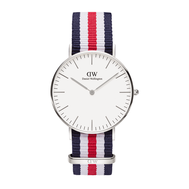 Classic Canterbury Silver features a minimalist eggshell white dial, polished silver case, and a striped NATO strap in blue, red, and white, blending timeless style with a relaxed, modern touch.