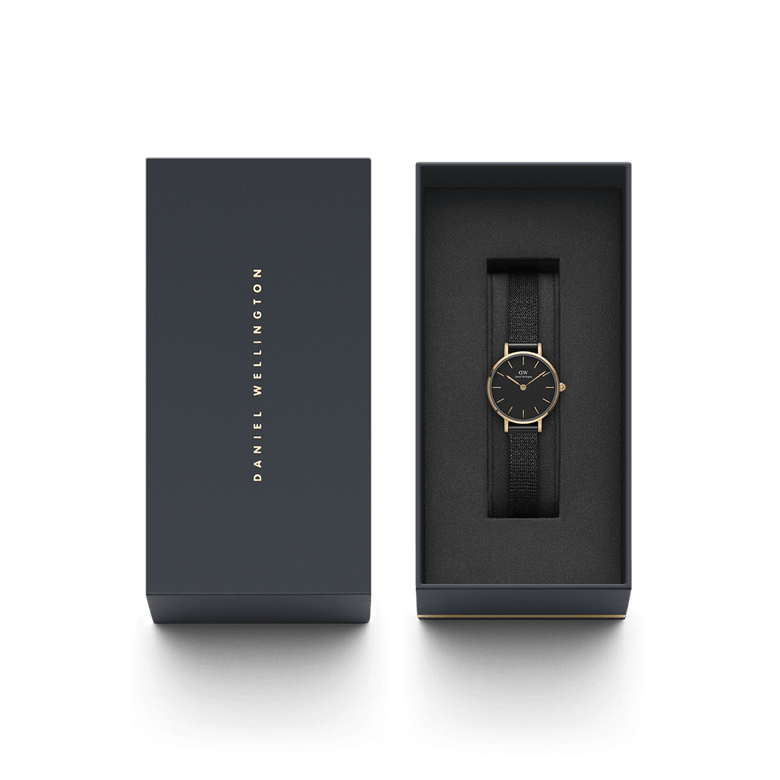 Petite Pressed Ashfield ladies watch with a rose gold case and black mesh strap, presented in a sleek Daniel Wellington gift box, ideal for gifting or adding to a collection.