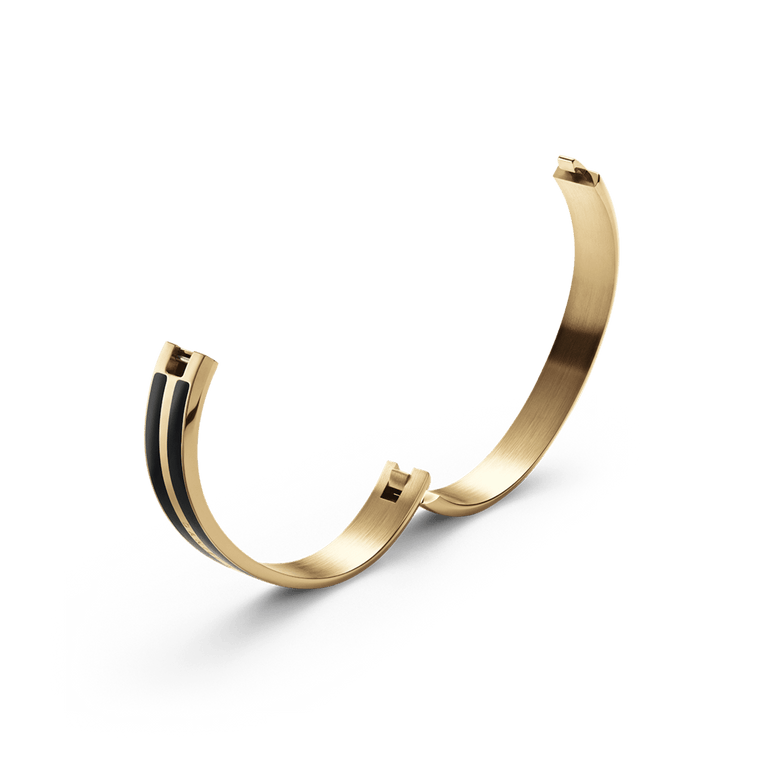 Emalie Infinite Gold Black bracelet shown open, highlighting the integrated closure and polished gold stainless steel with black enamel detailing, designed for a secure and comfortable fit.