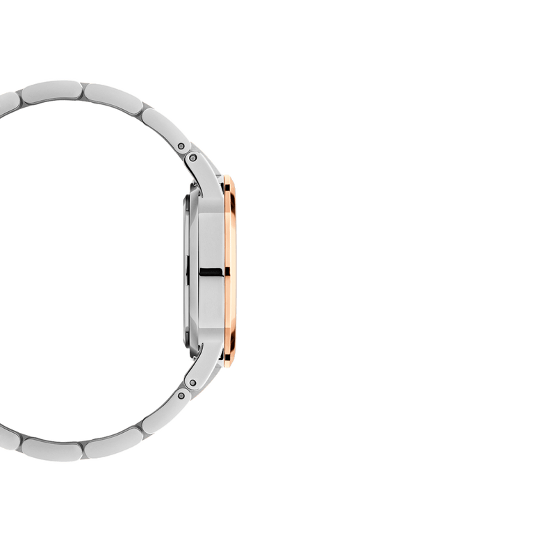 Side profile view of the Iconic Link Lumine Rose Gold ladies watch, showing its slim stainless steel case with polished rose gold accents and a two-tone link bracelet.