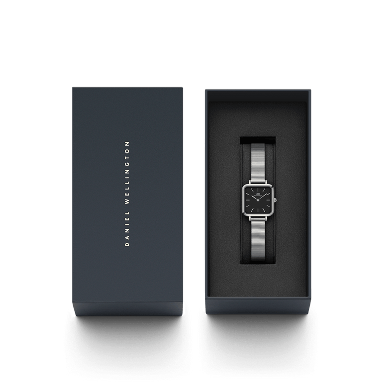 Quadro Studio Silver ladies watch with a square black dial and polished silver piano link strap, elegantly presented in a branded gift box.