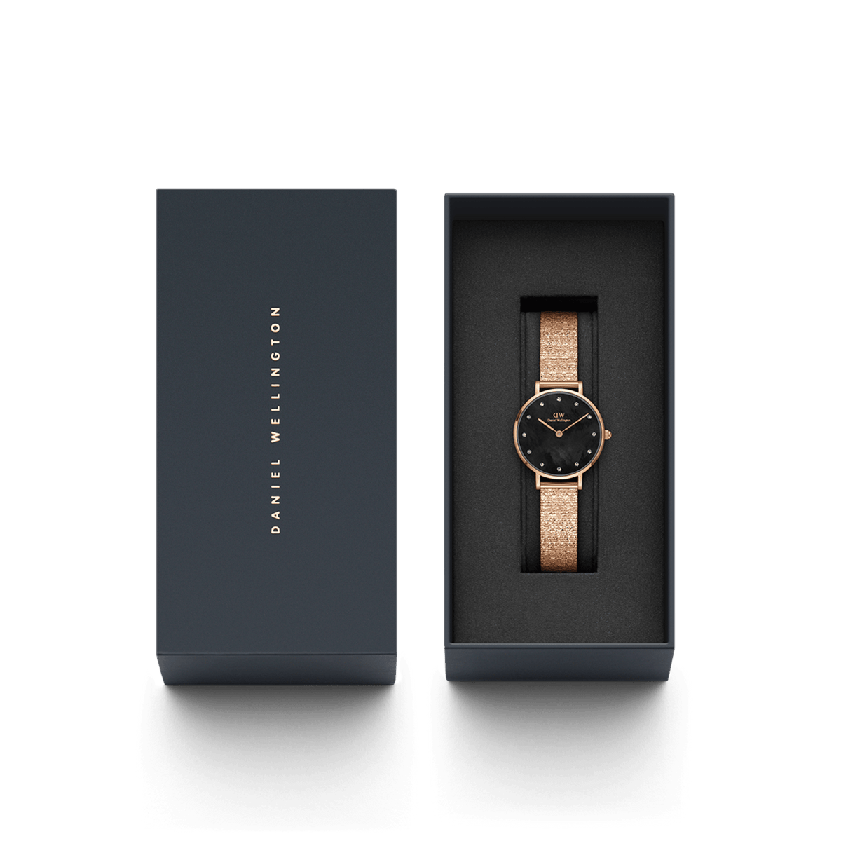 Petite Lumine Pressed Piano Black MoP Rose Gold ladies watch presented in a sleek Daniel Wellington gift box, featuring a rose gold pressed piano link strap and a black mother of pearl dial with crystal markers.