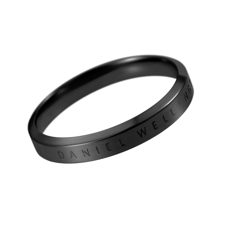 Sleek black stainless steel band ring with subtle Daniel Wellington engraved branding, featuring a minimalist silhouette and smooth finish suitable for both men and women.