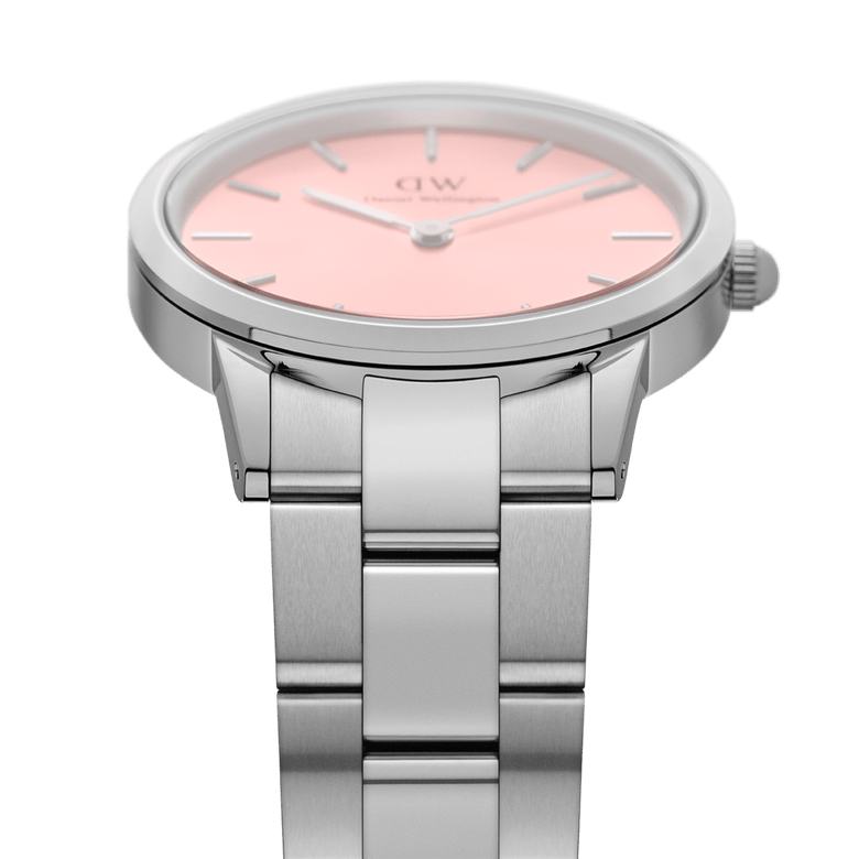 Detail view of the Iconic Link Blush Silver ladies watch, showing the brushed stainless steel bracelet and the soft pastel pink dial with minimalist silver hour markers.