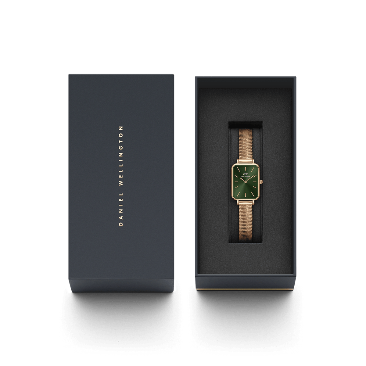 Quadro Pressed Melrose Emerald ladies watch with a rectangular emerald green dial and rose gold mesh strap, elegantly presented in a branded Daniel Wellington gift box.