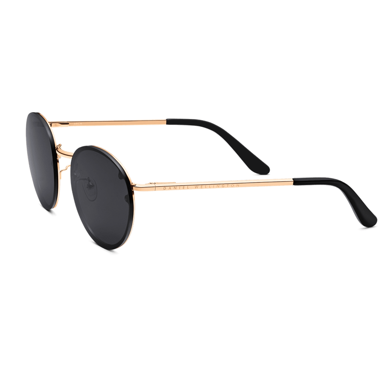 Arch Steel Black sunglasses featuring round black nylon lenses, a rose gold plated stainless steel frame, slim black arms, and subtle Daniel Wellington branding along the side.
