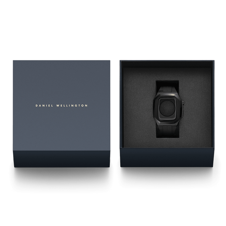 Switch Black Black Apple Watch case presented in a premium Daniel Wellington gift box, featuring a brushed stainless steel frame and integrated FKM rubber strap for Series 6, 5, 4, and SE models.