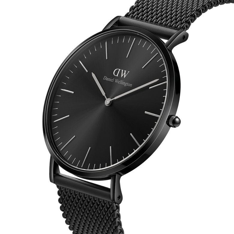 Classic Mesh Onyx Black watch with a 40mm black stainless steel case, minimalist black sunray dial, and a woven mesh bracelet, shown from a side angle to highlight its slim profile and modern monochrome design.