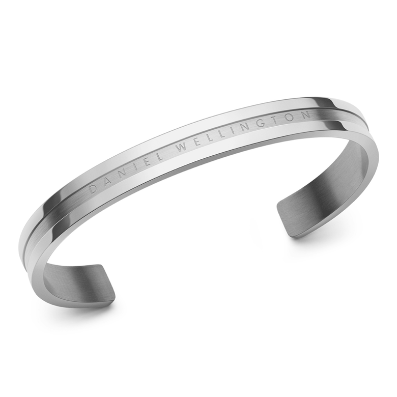Elan Bracelet Silver with a sleek, minimalist open cuff design in polished stainless steel, featuring the Daniel Wellington logo engraved along the front band.