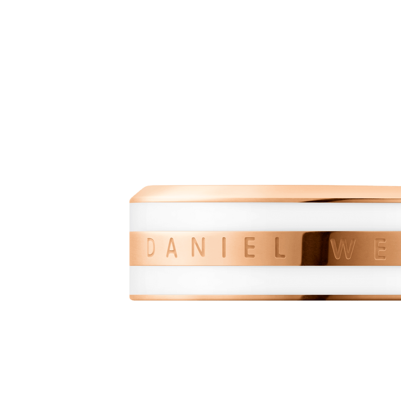 Close-up of the Daniel Wellington Emalie Ring Satin White Rose Gold, highlighting the engraved branding on the polished rose gold band with a satin white enamel finish and minimalist design.