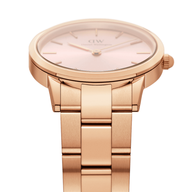 Detail view of the Iconic Link Pink Rose Gold ladies watch showing the brushed rose gold stainless steel link bracelet and the soft pink sunray dial with minimalist gold markers.