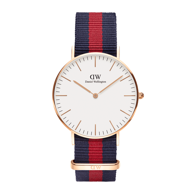 Classic Oxford Rose Gold watch with a minimalist white dial, slim rose gold case, and a blue and red striped NATO fabric strap, designed for versatile everyday wear.