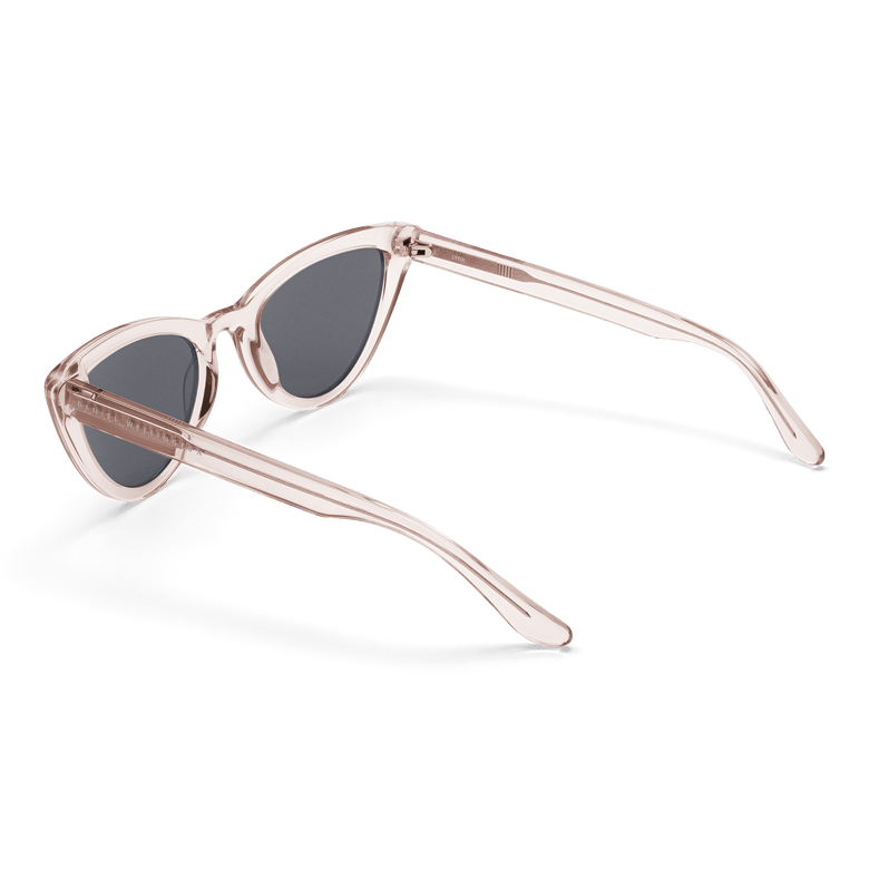 Lynx Bio-Acetate Clear Pink/Black sunglasses with a transparent pink cat eye frame, dark nylon lenses, and elegantly curved arms designed for comfortable, stylish wear.