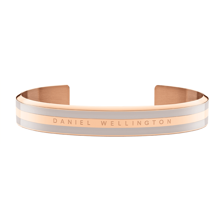Emalie Bracelet Desert Sand Rose Gold features a wide rose gold cuff with desert sand enamel and Daniel Wellington branding, showcasing a modern minimalist style ideal for everyday wear.
