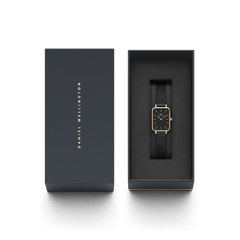 Quadro Pressed Ashfield B 29x36,5 Rose Gold ladies watch with a rectangular rose gold case and black mesh strap, elegantly presented in a Daniel Wellington branded gift box.