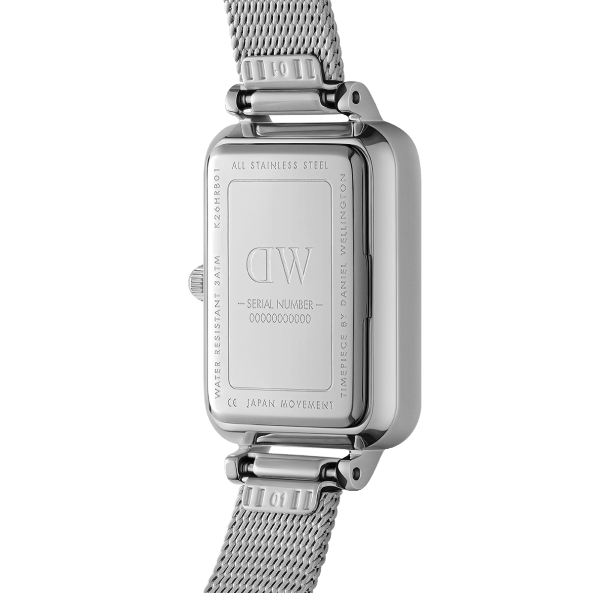 Rear view of the Quadro Pressed Unitone Silver ladies watch showing the engraved stainless steel case, water resistance details, and the silver mesh strap.