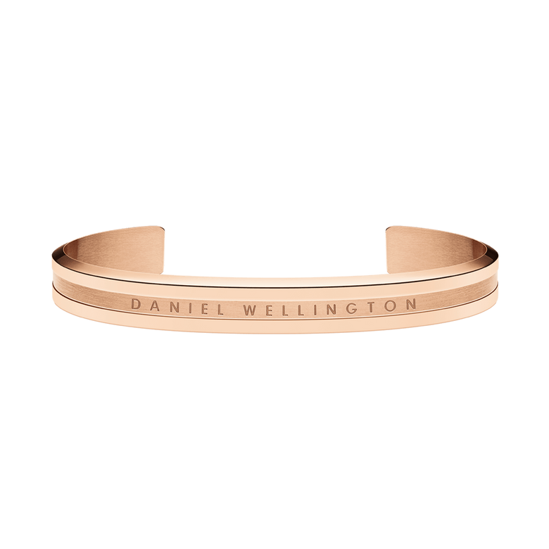 Rose gold Elan Bracelet by Daniel Wellington featuring a minimalist open cuff design, polished finish, and engraved logo, crafted from stainless steel with PVD plating.