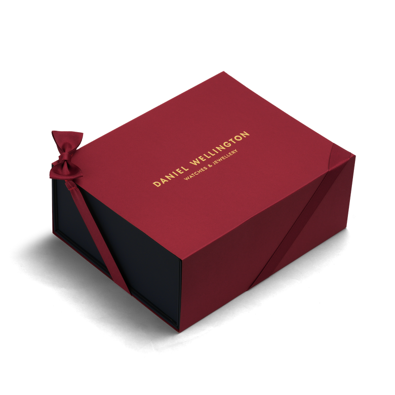 Premium Gift Box Red by Daniel Wellington featuring a deep red colour, gold logo, and ribbon detail, designed for presenting watches or jewellery in an elegant and secure packaging.