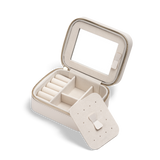 Travel Jewellery Box White with a soft white exterior, gold zip, and removable divider, showing ring rolls, multiple compartments, and a built-in mirror for organised jewellery storage and easy access.
