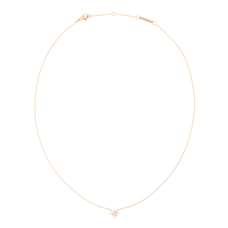 Delicate rose gold necklace featuring a fine chain and a small star-shaped pendant set with sparkling white cubic zirconia stones, designed to sit elegantly on the collarbone.