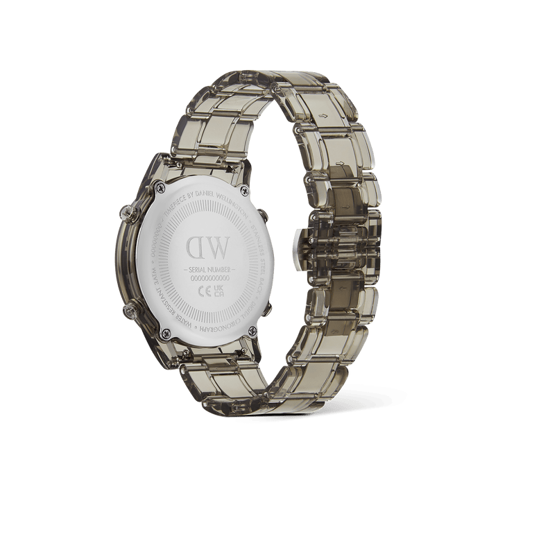 Retro Digital Light Grey Light Grey watch showing the back of the round case, engraved with branding and serial number, and a transparent light grey link strap with butterfly buckle.
